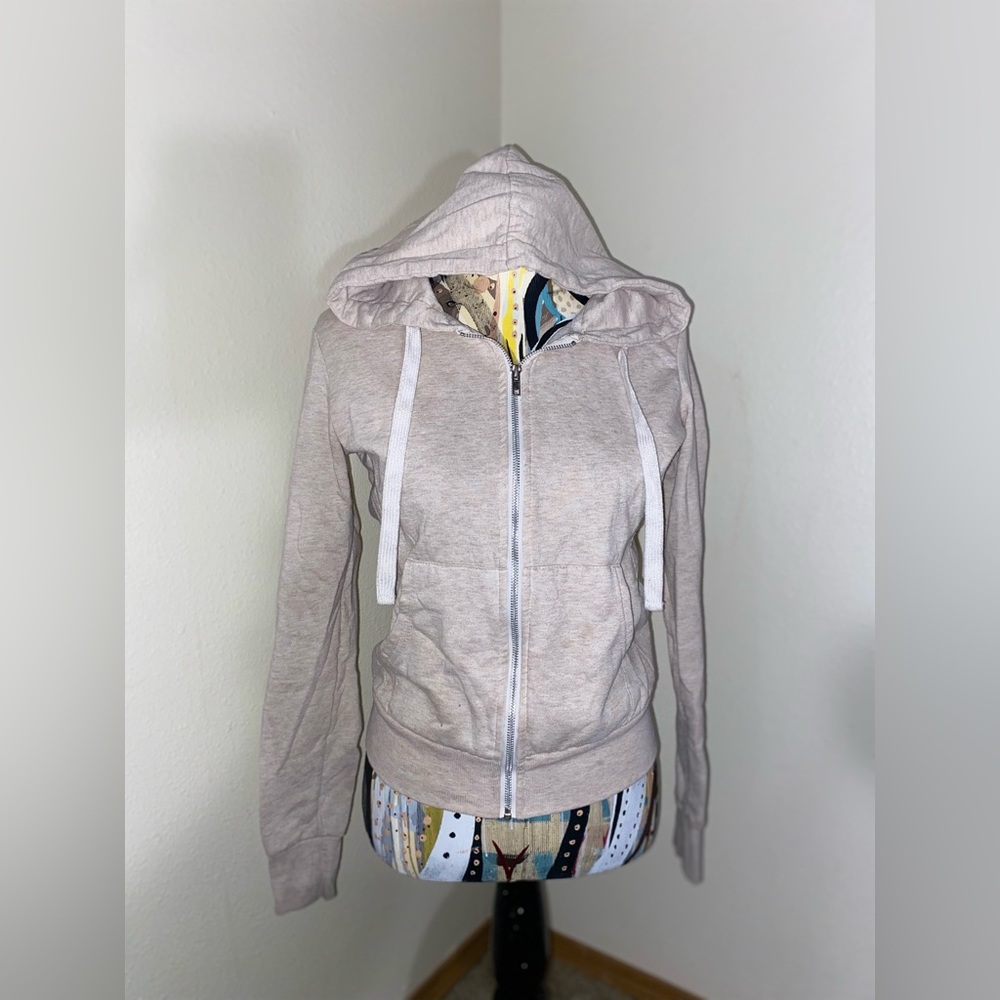 Cream/beige zip up sweater. Size: S. W/ draw string and hoodie.